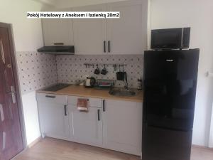 Kuchyň nebo kuchyňský kout v ubytování Apartamenty pod Dzikowcem