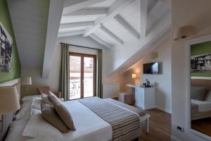 Voodi või voodid majutusasutuse Hotel Garni Corona toas