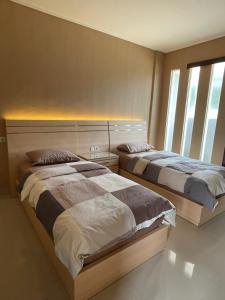 Posteľ alebo postele v izbe v ubytovaní Blue Breeze Villa