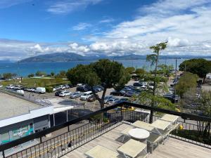 a balcony with a view of a parking lot at Alevic Hotel Sirmione in Sirmione