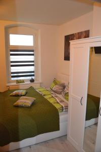 Ένα ή περισσότερα κρεβάτια σε δωμάτιο στο Apartment Editha Wohnung im EG Zentrumsnah