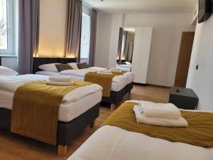 Posteľ alebo postele v izbe v ubytovaní Good Sleep