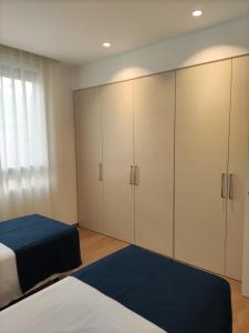 Łóżko lub łóżka w pokoju w obiekcie Iberflat Apartamentos Trinidad