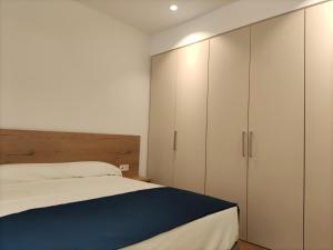 Łóżko lub łóżka w pokoju w obiekcie Iberflat Apartamentos Trinidad