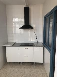 Kuchyňa alebo kuchynka v ubytovaní Bonito apartamento céntrico cerca de Sevilla