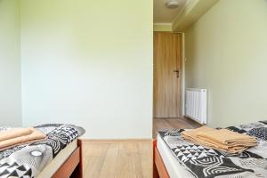 Postel nebo postele na pokoji v ubytování Farma Serock