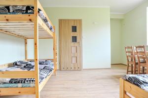 Postel nebo postele na pokoji v ubytování Farma Serock