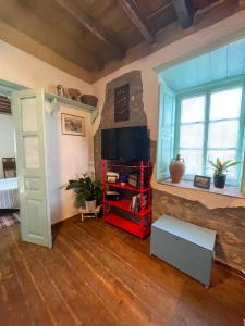 TV a/nebo společenská místnost v ubytování Patmos Horizon