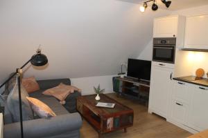 Kuchyň nebo kuchyňský kout v ubytování Ferienwohnung Lasse in Wieck