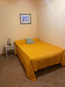 A bed or beds in a room at Tenuta Guardavaglia