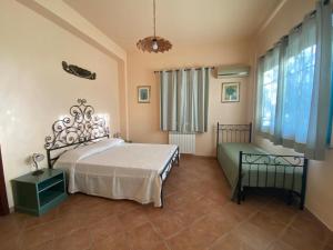 A bed or beds in a room at Tenuta Guardavaglia