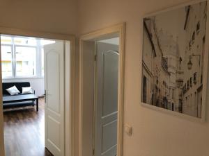 a door to a room with a picture on the wall at APT im Herzen von Mainz in Mainz