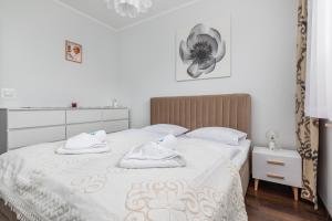 Säng eller sängar i ett rum på Platan Apartments Świnoujście Center IV by Renters