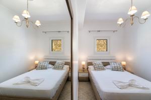 Postel nebo postele na pokoji v ubytování Panos Villa Asteras