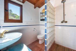 a bathroom with a sink toilet and a window at Finca Las Nuevas Casa Maria Arriba in Alora +23 photos