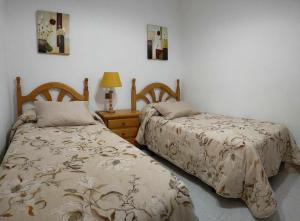 Krevet ili kreveti u jedinici u okviru objekta Ideal FAMILIAS hasta 15 Personas en San Martín de Valdeiglesias Madrid