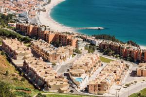 an aerial view of a resort and the beach at Sesimbra Natural Room and private access in Sesimbra
