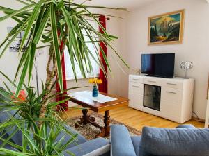 a living room with a couch and a table at Am Alten Haus in Altenmedingen