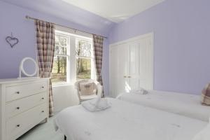 Кровать или кровати в номере Balcraig House