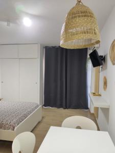 TV i/ili zabavni centar u objektu Apartamento Minerva Jupiter. The perfect accommodation for your vacation