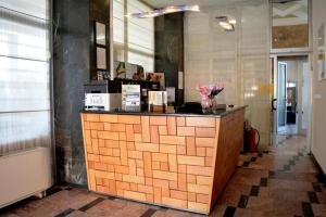 a lobby with a counter in a room at Hotel Lukavac in Lukavac