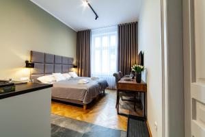 Posteľ alebo postele v izbe v ubytovaní MILU Apartments Kurkowa