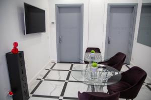 TV a/nebo společenská místnost v ubytování FlyHouse Fiumicino