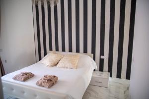 Postel nebo postele na pokoji v ubytování FlyHouse Fiumicino