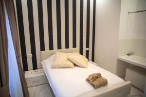 Postel nebo postele na pokoji v ubytování FlyHouse Fiumicino