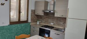 A kitchen or kitchenette at Mary Home - Casa Vacanza Taormina