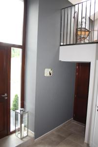 a hallway with a staircase and a stair case at Appartement Duplex Au Chat'rme des Blanches Pierres in Francorchamps +31 photos