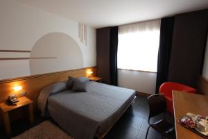 Postel nebo postele na pokoji v ubytování Hotel Europa Belluno