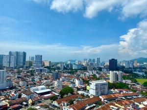 a city with many buildings and a city skyline at Tropicana 218 Macalister Sea & City View by stayCATion Homestay in George Town