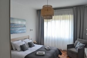 Postel nebo postele na pokoji v ubytování Apartment Céleste - Directly on the Beach