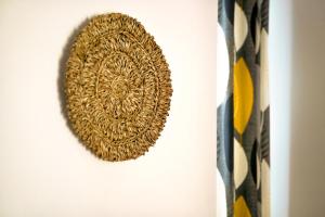 a wall hanging with a gold mandala on it at Amaranto in Maratea