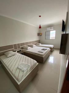 Postel nebo postele na pokoji v ubytování Hotel Cumbica Guarulhos