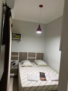 Postel nebo postele na pokoji v ubytování Hotel Cumbica Guarulhos