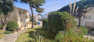 a view of a street with buildings and trees at MACH HOUSE you will like it ! in Tamariu