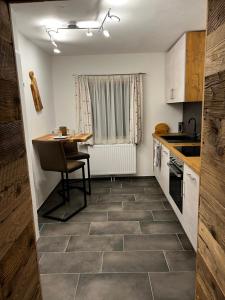 a small kitchen with a table and a counter at Gaisbergblick in Molln