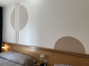 Postel nebo postele na pokoji v ubytování Hotel Europa Belluno