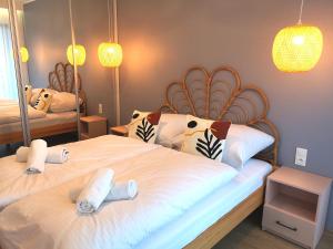 Posteľ alebo postele v izbe v ubytovaní Apartament Pod Papugami Karpatia Resort