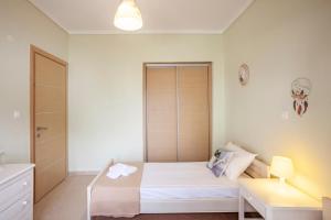 Postel nebo postele na pokoji v ubytování Sea side home Valentina