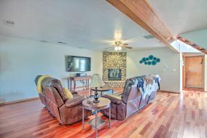 a living room with two chairs and a table at Casa Especial Family Retreat with Pool Table! in Alameda