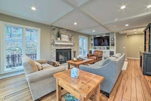 a living room with two couches and a fireplace at Harbor Springs Retreat about 5 Mi to Downtown and Beach! in Harbor Springs