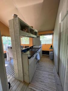 A kitchen or kitchenette at Glamour Glamping at little beach