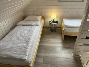 Ліжко або ліжка в номері Domkoland