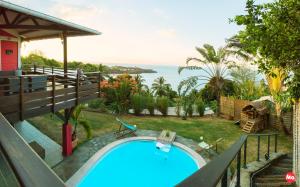 a swimming pool with a view of the ocean at Villa Hawa in Koungou