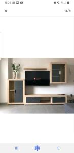 a living room with a large entertainment center at Las Terrazas II in Granadilla de Abona
