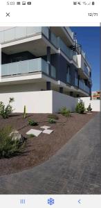 a large building with a landscaping in front of it at Las Terrazas II in Granadilla de Abona