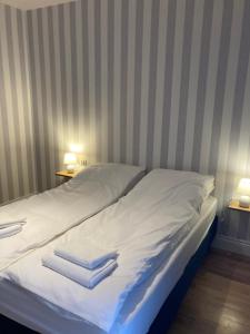 Ένα ή περισσότερα κρεβάτια σε δωμάτιο στο W Starym Porcie - Apartament - 2 sypialnie